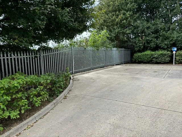 Installation of steel palisade fencing at a car dealership
